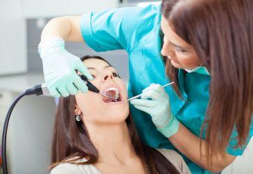 woman receiving dental exam | dental cleans mccrae