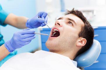 man in dentist exam chair | dentist mccrae