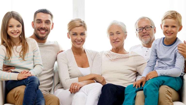 large family sitting | dentist near me